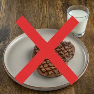 a steak and a glass of milk representing what not to compost