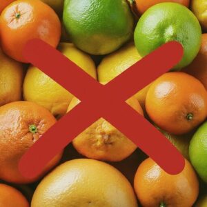 pile of citrus fruits with a big red X through them representing what not to compost