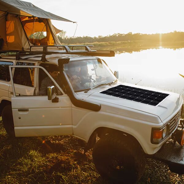 Flexible Solar Panel Kit installed on hood of car for living off the grid