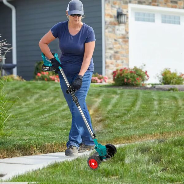 woman trimming grass with the cordless electric brush cutter available at Farm and Home Supply